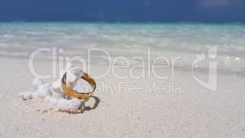 v01051 Maldives beautiful beach background white sandy tropical paradise island with blue sky sea water ocean 4k gold wedding ring coral