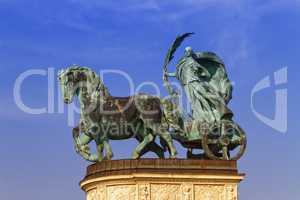 Statue representing Peace, a woman holding a palm frond on a chariot, on a colonnade in Heroes Square or Hosok Tere, Budapest, Hungary.