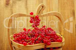 red currant on the wooden vase