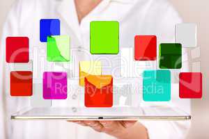 Woman holding tablet pc with colorful glassware