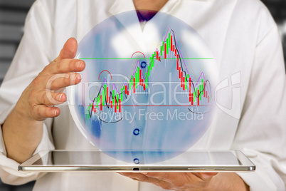 Woman holding tablet pc with glass ball