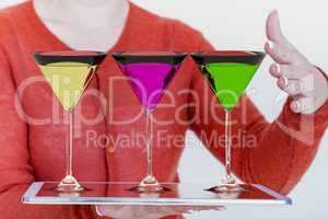 Woman wearing on tablet PC cocktail glasses