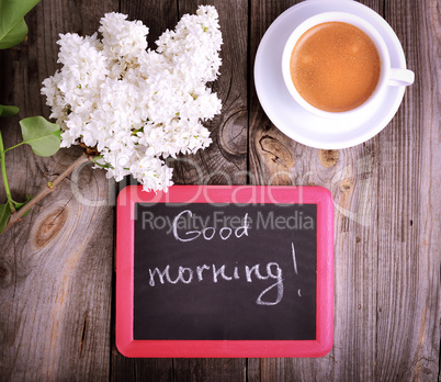 cup of coffee and a black board