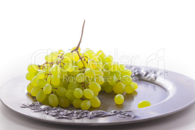 Bunch of white grapes on a tray