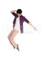 Asian man dancing on his toes.