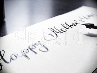 Happy Mother's day calligraphy and lattering post card. Extremely close-up.