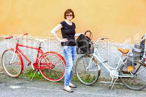 Woman with bicycle when shopping