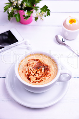 cup of coffee, egg and mobile phone
