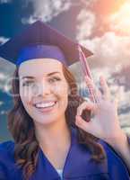 Happy Graduating Mixed Race Woman In Cap and Gown