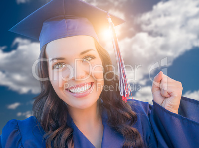 Happy Graduating Mixed Race Woman In Cap and Gown