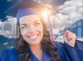 Happy Graduating Mixed Race Woman In Cap and Gown