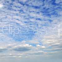 Cumulus and cirrus clouds in the blue sky.