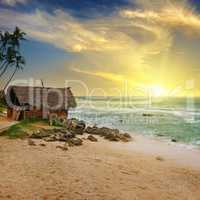 An old fisherman's hut on the shore of a picturesque ocean and a