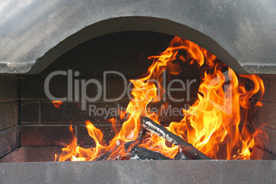 Fire and brazier under a canopy