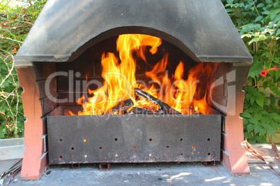 Fire from the brazier under a canopy