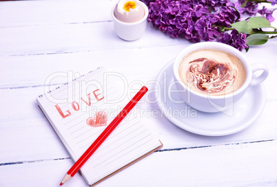 Notepad with a love pencil inscription