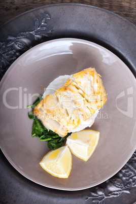 Fried cod fillets and spinach