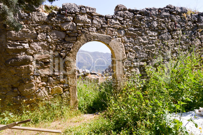 Ruined wall with an arcade door and