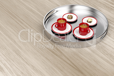 Silver tray with coffee and chocolate candies