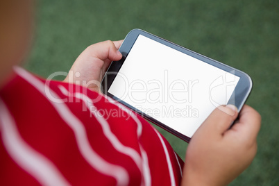 Close up of boy using mobile phone