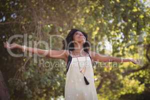Smiling woman with arms outstretched