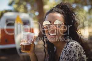 Happy woman holding beer glass