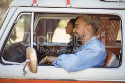 Woman with man driving van