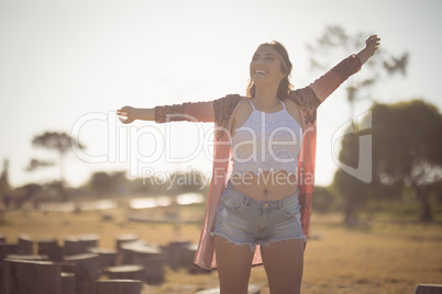 Happy woman standing on field