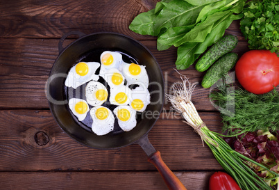 Fried quail eggs in a frying pan