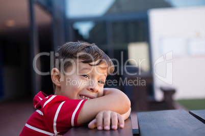 Close up of cheerful boy looking away