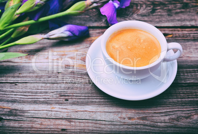 cup of coffee on a gray wooden surface