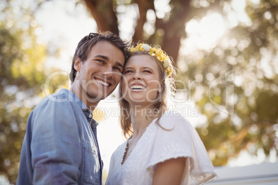 Happy couple looking away