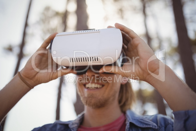 Young man wearing virtual reality simulator