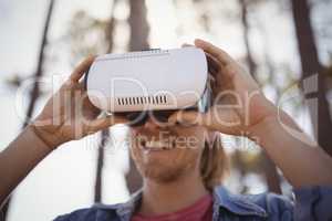 Young man wearing virtual reality simulator