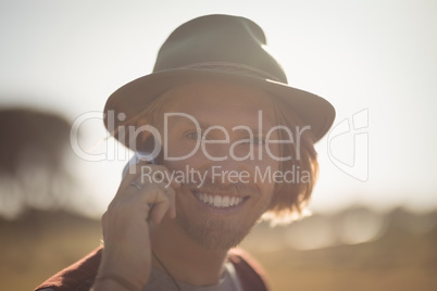 Portrait of smiling man talking on phone