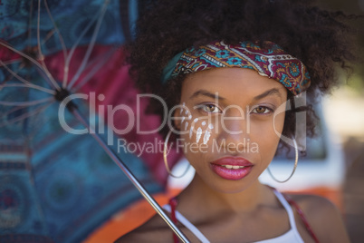 Close-up portrait of woman with umbrella