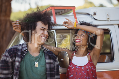 Happy woman pulling man hair