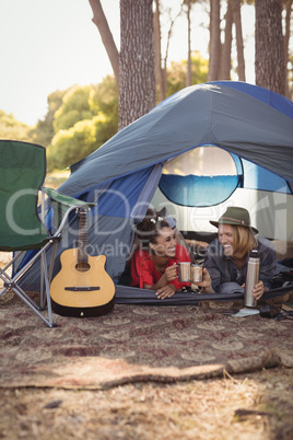 Couple relaxing in tent