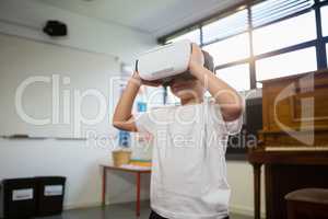 Close of boy holding virtual reality simulator