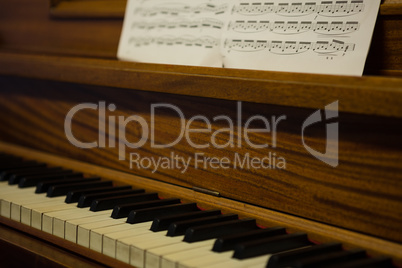 Close up of piano and sheet music