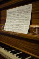 Close up of sheet music on piano