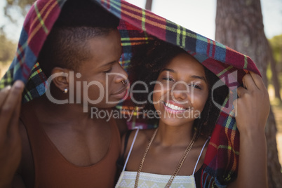 Close up of smiling couple in blanket
