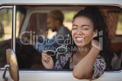 Portrait of woman with friend in van