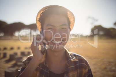 Portrait of smiling man talking on mobile phone