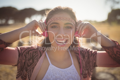 Portrait of woman listening to music