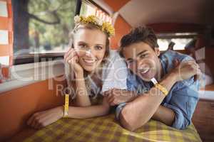 Portrait of happy couple in van