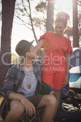 Smling couple looking at each other at forest