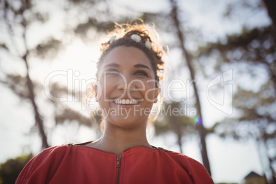 Low angle view of thoughtful smiling young woman