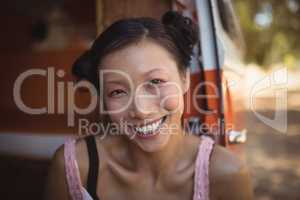 Portrait of smiling woman sitting in mini van