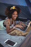 Portrait of woman using digital laptop